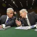 Defense Secretary Chuck Hagel, left, and Robert F. Hale, the Defense Department's comptroller, confer as they prepare to testify before the Senate Armed Services Committee on the department's fiscal year 2015 budget request on March 5, 2014. DOD photo by Glenn Fawcett