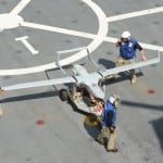 Members of the RQ-21A Blackjack test team transport the RQ-21A Blackjack across the flight deck of the San Antonio-class amphibious transport dock USS Mesa Verde (LPD 19) after its first flight at sea Feb. 10, 2013. (U.S. Navy photo)