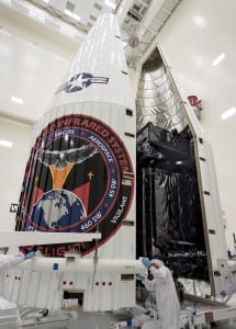 Lockheed Martin employees encapsulate the Air Force's SBIRS GEO 3 satellite before its launch. Photo: Lockheed Martin.