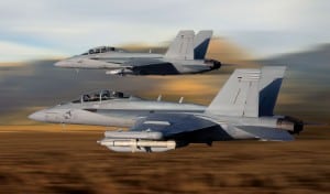 An E/A-18 Growler electronic attack aircraft in the foreground shadowed by a F/A-18E/F Super Hornet. (Photo: Boeing)