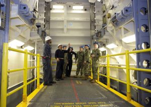 Personnel go over safety procedures for the Upper Stage 1 advanced weapons elevator (AWE) with sailors from USS Gerald R. Ford's (CVN 78) weapons department in Newport News, Va. in January. This was the first of 11 elevators delivered to the ship. (Photo: U.S. Navy)