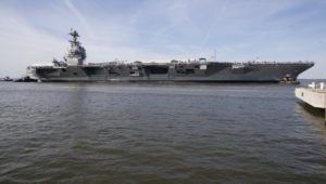 USS Gerald R. Ford (CVN-78) is maneuvered by tugboats in the James River during Ford's turn ship evolution during its post-shakedown availability in March at Huntington Ingalls Industries-Newport News Shipbuilding. (Photo: U.S. Navy)