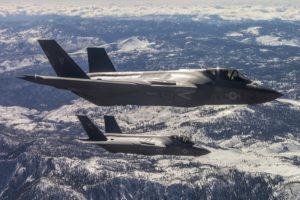 Two F-35C Lightning II aircraft from Naval Air Station Lemoore fly in formation over the Sierra Nevada Mountain Range after completing a training mission (U.S. Navy Photo)