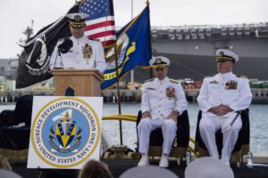 Capt. Henry Adams, speaks during the establishment ceremony of Surface Development Squadron ONE (SURFDEVRON ONE) on May 22. Seated from left to right are Vice Adm. Richard Brown, Commander of Naval Surface Force, U.S. Pacific Fleet (CNSP) and Capt. Scott Carroll. (Photo: U.S. Navy)