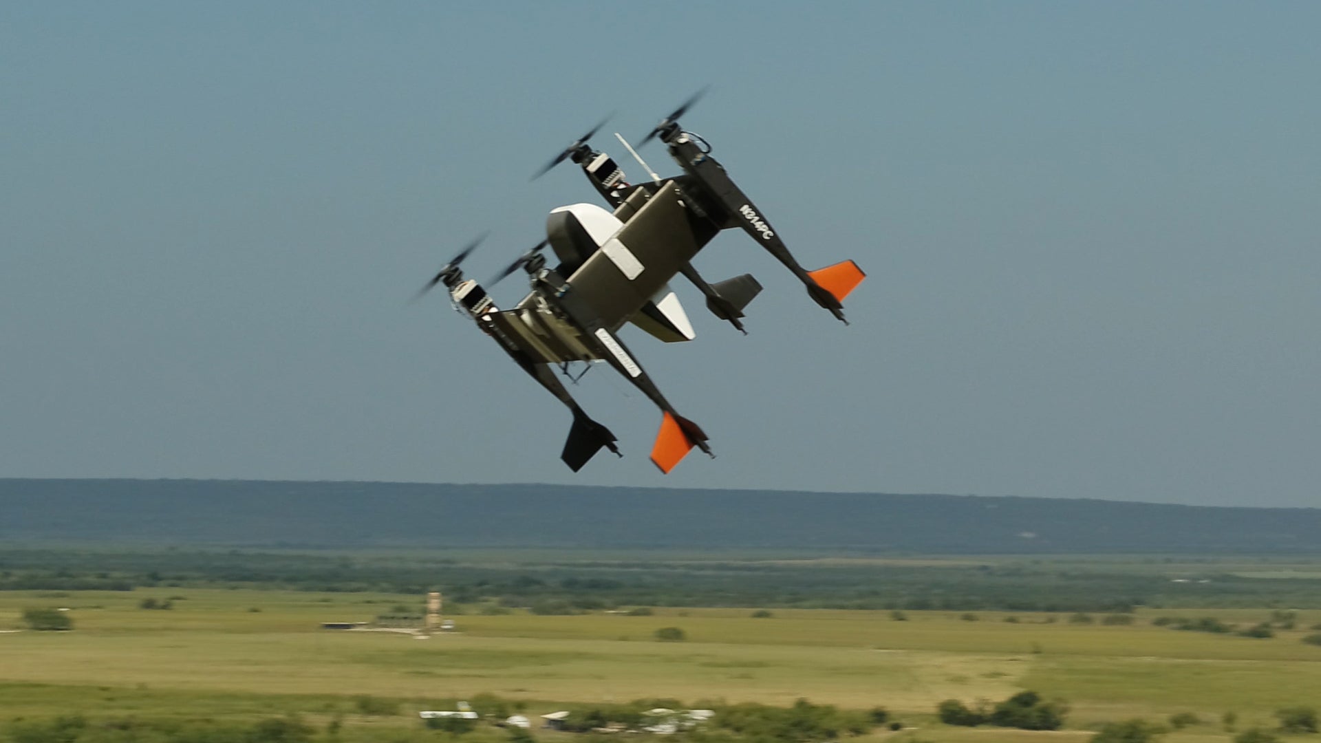 Bell Flight's APT-70 autonomous logistics drone, equipped with Yamato's PUPA-70XG pod, flies above Texas.