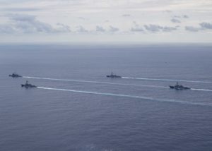The Ticonderoga-class guided-missile cruiser USS Normandy (CG-60), far left, and the Arleigh Burke-class guided-missile destroyers, USS Farragut (DDG-99), left, USS Forrest Sherman (DDG-98), middle, and USS Lassen (DDG-82), right, steam in formation during transit of the Atlantic Ocean as part of a Surface Action Group on Sept. 16. (Photo by U.S. Navy)