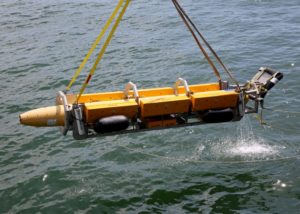 An unmanned underwater vehicle (UUV) Knifefish mine countermeasures platform being recovered by Military Sealift Command's expeditionary sea base, USNS Hershel "Woody" Williams (T-ESB 4), while the ship was at anchor in the Chesapeake Bay, Sept. 14. This was the first time a UUV was launched and recovered by an expeditionary sea base. (Photo: U.S. Navy)