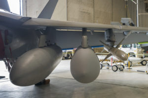 One of the first pictures of the Raytheon Next Generation Jammer Mid-Band pod installed on an EA-18G Growler. (Photo: Raytheon)