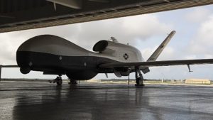 An MQ-4C Triton unmanned aircraft system sits in a hangar at Andersen Air Force Base, Guam after arriving for a deployment as part of an early operational capability (EOC) test as part of Unmanned Patrol Squadron (VUP) 19, the first Triton UAS squadron. (Photo: U.S. Navy)