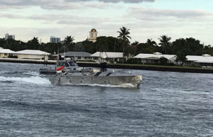 The Unmanned Influence Sweep System (UISS) unmanned surface vessel, accompanied by an escort vessel, heads out for an Operational Assessment mission off the coast of South Florida in November 2019. (Photo: U.S. Navy)
