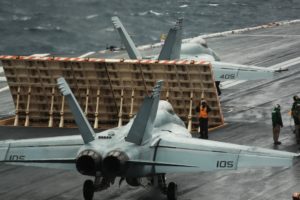 F/A-18E and F Super Hornets assigned to Carrier Air Wing (CVW) 8, stack up in preparation for launch from the flight deck of USS Gerald R. Ford (CVN-78) during flight operations in the Atlantic Ocean on March 21, 2020 while conducting carrier qualifications. (Photo: U.S. Navy)