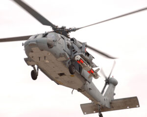 An MH-60S with the AN/ASQ-235 Airborne Mine Neutralization System (AMNS), loaded with four Archerfish Destructor mine neutralizers. (Photo: BAE Systems)