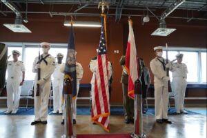 Personnel at Naval Support Facility (NSF) Redzikowo mark the official turnover of the base’s support facilities from the U.S. Army Corps of Engineers to the U.S. Navy (Photo: U.S. Navy)