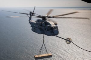 A CH-53K King Stallion receives fuel from a C-130 tanker while carrying a 27,000 lb. load in September 2020. (Photo: U.S. Navy)