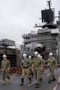 Secretary of the Navy Kenneth Braithwaite tours fire damage aboard the amphibious assault ship USS Bonhomme Richard (LHD-6) during a visit to the ship at Naval Base San Diego in July. (U.S. Navy photo by Mass Communication Specialist 1st Class Jason Kofonow)