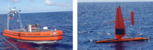 Watcher (left) and Saildrone unmanned surface vehicles during evaluation in 2020. (Photo: Coast Guard)