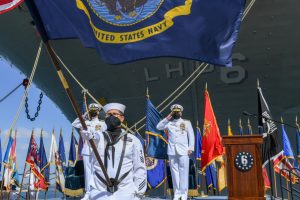 Rear Adm. Philip Sobeck, commander of Expeditionary Strike Group Three, and Capt. G. S. Thoroman, commanding officer of amphibious assault ship USS Bonhomme Richard (LHD-6), salute the ensign for colors during a decommissioning ceremony for Bonhomme Richard at Naval Base San Diego on April 14, 2021. (Photo: U.S. Navy by Mass Communication Specialist 2nd Class Alex Millar)