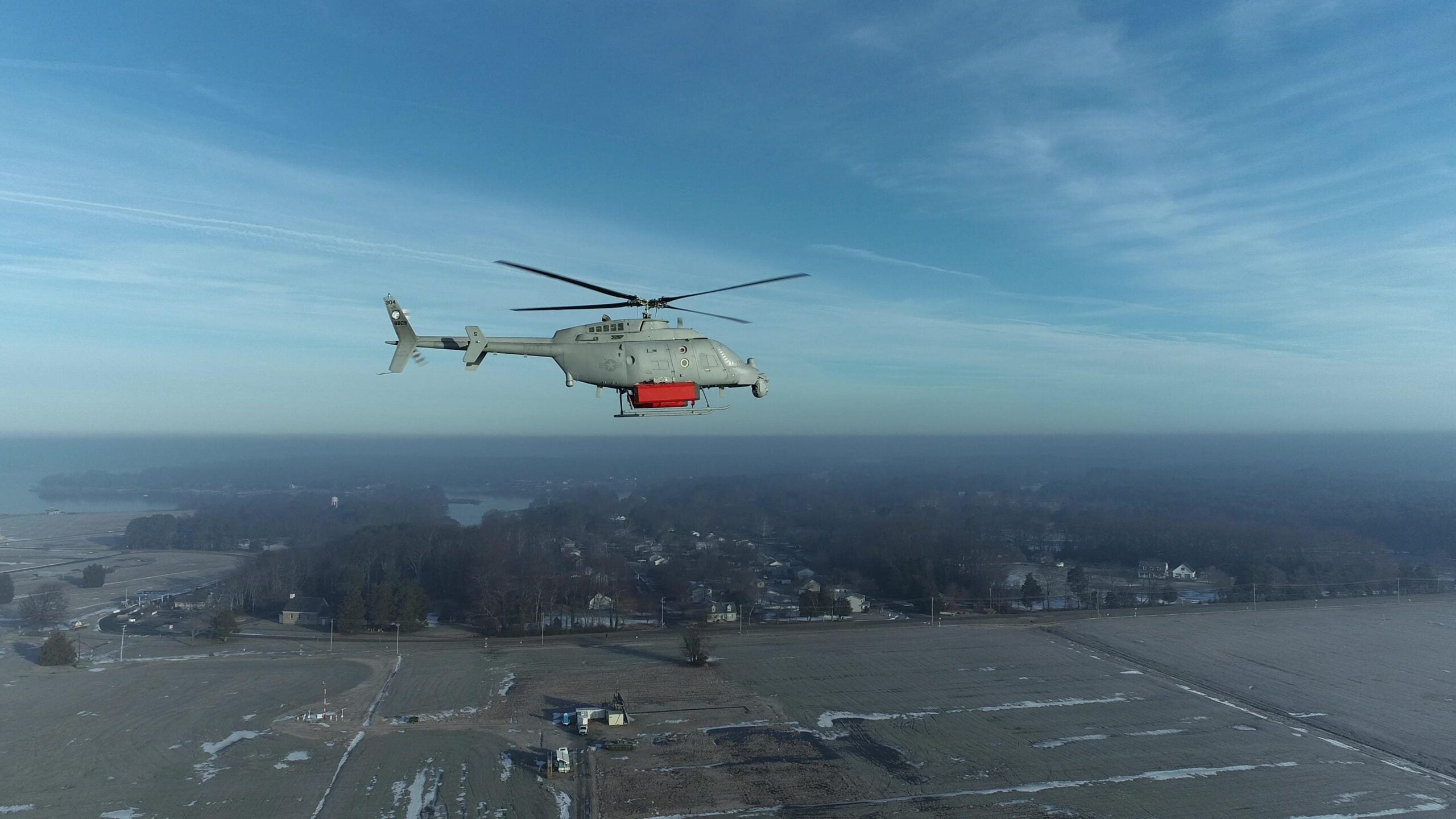 An MQ-8 Fire Scout, with mass shapes attached, conducted low airspeed flying qualities testing in February 2022 at Webster Field, Md. to prepare for upcoming the Single System Multi-Mission Airborne Mine Detection (SMAMD) demonstration. (Photo: U.S. Navy)