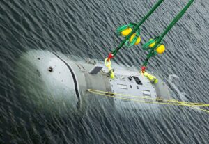 The Snakehead Large Unmanned Undersea Vehicle (LDUUV) is loaded in Narragansett Bay in Newport, R.I. prior to christening on Feb. 2, 2022. (Photo: U.S. Navy)