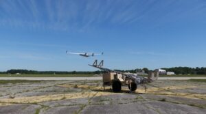 An RQ-21 Blackjack launches over an airfield at Naval Air Station Patuxent River in July 2022 to support the first flight test of Guardian, the new ground-based detect and avoidance system that tracks manned and unmanned aircraft. (Photo: U.S. Navy)