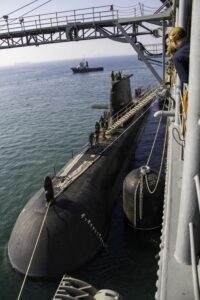 The Royal Australian Navy Collins-class submarine HMAS Farncomb (SSG 74) moors alongside the Emory S. Land-class submarine tender USS Frank Cable (AS 40) at HMAS Stirling naval base, April 19, 2022. (Photo: U.S. Navy by Mass Communication Specialist 2nd Class Chase Stephens/Released)