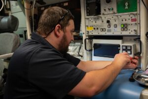 A Northrop Grumman field technician, secures the new Launch Control Center printer on Dec. 2 at the Kilo-01 Missile Alert Facility near Dix, Neb. (U.S. Air Force Photo)