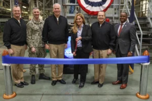 Officials cutting a ribbon to open the Next Generation Guided-Missile Destroyer (DDG(X)) Land Based Test Site (LBTS) at Philadelphia, Pa., on March 21, 2023. (From left) Naval Surface Warfare Center, Philadelphia Division Commanding Officer Capt. Joseph Darcy; PMS 460 Deputy Program Manager Capt. Dan Kidd; Director, Surface Warfare Division (N96) Office of the Chief of Naval Operations Rear Adm. Fred Pyle; Program Manager, PMS 460, Guided Missile Destroyer (DDG(X)), Program Executive Office Ships Katie Connelly; Program Executive Officer (PEO) for Ships Rear Adm. Thomas J. Anderson; and NSWCPD Technical Director Nigel C.(Photo: U.S. Navy by Sgt. Jermaine Sullivan)