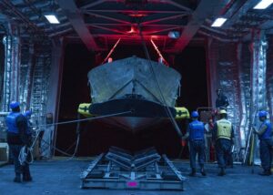 Sailors conduct mine countermeasures (MCM) unmanned surface vessel (USV) launch and recovery (L&R) operations in the mission bay of the USS Cincinnati (LCS 20) in fall 2022. (Photo: U.S. Navy)