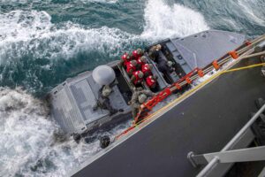 A Sailor climbs down a pilot ladder onto a combat craft assault (CCA) from the expeditionary sea base USS Hershel "Woody" Williams (ESB-4) in the Mediterranean Sea on Nov. 23, 2020. (Photo: U.S. Navy by Mass Communication Specialist Seaman Conner Foy)