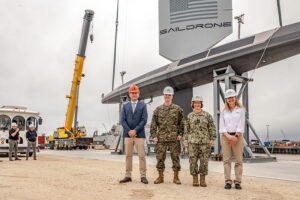 (From left to right:) Saildrone founder and CEO Richard Jenkins, ACMC Gen. Christopher J. Mahoney, CNO Adm. Lisa Franchetti and Austal USA Acting President Michelle Kruger stand in front of SD-3000, the first production Saildrone Surveyor USV to come off the Austal USA manufacturing line. (Photo: Austal USA)