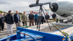 Military and industry representatives view the Anduril Altius 600M Unmanned Aerial Vehicle (UAV) loitering munition and Dive-LD AUV Large Diameter Unmanned Underwater Vehicle (LDUUV) on display as a part of Integrated Battle Problem (IBP) 24.1 at U.S. 3rd Fleet in San Diego, March 14, 2024. (Photo: U.S. Navy by Mass Communication Specialist 2nd Class Lily Gebauer)
