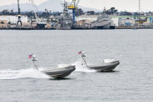 Two Global Autonomous Reconnaissance Craft (GARC) from Unmanned Surface Vessel Squadron 3 (USVRON 3) operate remotely in San Diego Bay ahead of the unit's establishment ceremony. (Photo: U.S. Navy by Mass Communication Specialist 1st Class Claire M. DuBois)
