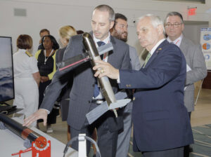 U.S. Sen. Jack Reed (right), chairman of the Senate Committee on Armed Services, inspects the Submarine Launched Unmanned Aerial System (SLUAS) developed by the Naval Undersea Warfare Center Division Newport, alongside Greg Walsh, technical project manager for the SLUAS program, during Defense Innovation Days held in Newport, Rhode Island on Aug. 28, 2023. (Photo: U.S. Navy)