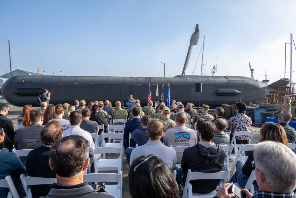 Former Chief of Naval Operations (CNO) Adm. Lisa Franchetti on Dec. 6, 2024 toured Boeing’s Orca Extra Large Unmanned Undersea Vehicle (XLUUV) manufacturing facility, met with Boeing contractors and Sailors assigned to Unmanned Undersea Vehicles Squadron (UUVRON) 3, and gave remarks about the importance of having robotic multi-mission submersibles in the fleet. (Photo: U.S. Navy by Chief Mass Communication Specialist William Spears)