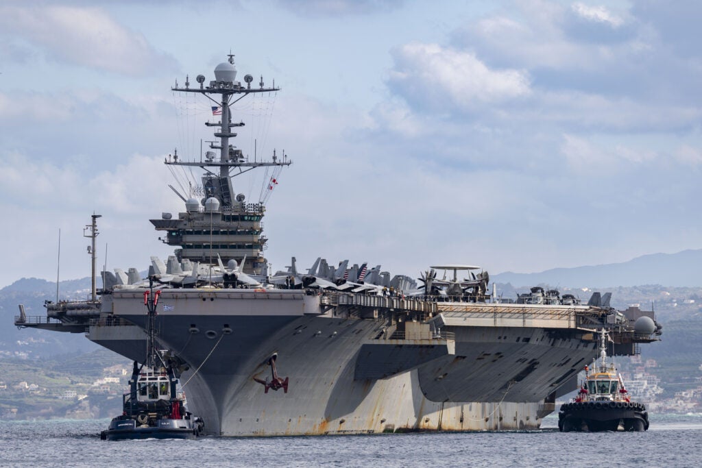 The Nimitz-class aircraft carrier USS Harry S. Truman arrives at the NATO Marathi Pier Complex in Souda Bay, Crete, Greece, in February 2025.