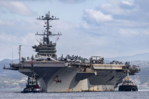 The Nimitz-class aircraft carrier USS Harry S. Truman arrives at the NATO Marathi Pier Complex in Souda Bay, Crete, Greece, in February 2025.