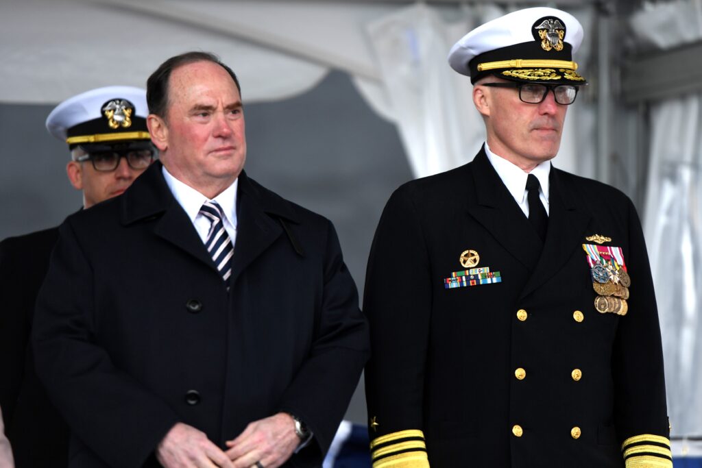 Secretary of the Navy John Phelan and Vice Adm. Rob Gaucher, commander of the U.S. Navy’s Submarine Force, take their place on the podium during a commissioning ceremony for the fast-attack submarine USS Iowa (SSN 797) in Groton, Conn. on April 5, 2025. (Photo: U.S. Navy by Chief Petty Officer Joshua Karsten)