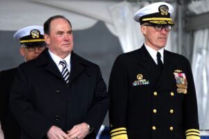 Secretary of the Navy John Phelan and Vice Adm. Rob Gaucher, commander of the U.S. Navy’s Submarine Force, take their place on the podium during a commissioning ceremony for the fast-attack submarine USS Iowa (SSN 797) in Groton, Conn. on April 5, 2025. (Photo: U.S. Navy by Chief Petty Officer Joshua Karsten)