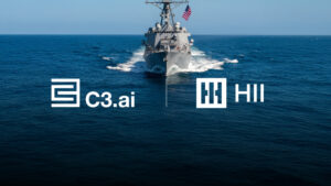 Image of a U.S. navy ship sailing towards the camera with the water split between the logos for C3.ai and HII, illustrating their increasing partnership.