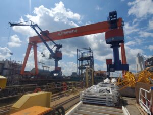 Hanwha Philly Shipyard's Dock 4 with its goliath crane in July 2025. (Photo: Defense Daily)