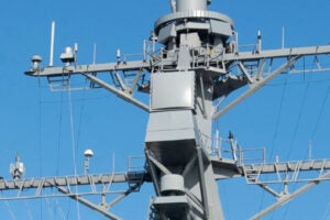 A AN/SPQ-9B radar panel, center square equipment, fitted on a Navy warship from a 2024 announcement when the service awarded Leonardo DRS a contract to produce the radars for Navy ships. (Photo: Leonardo DRS)