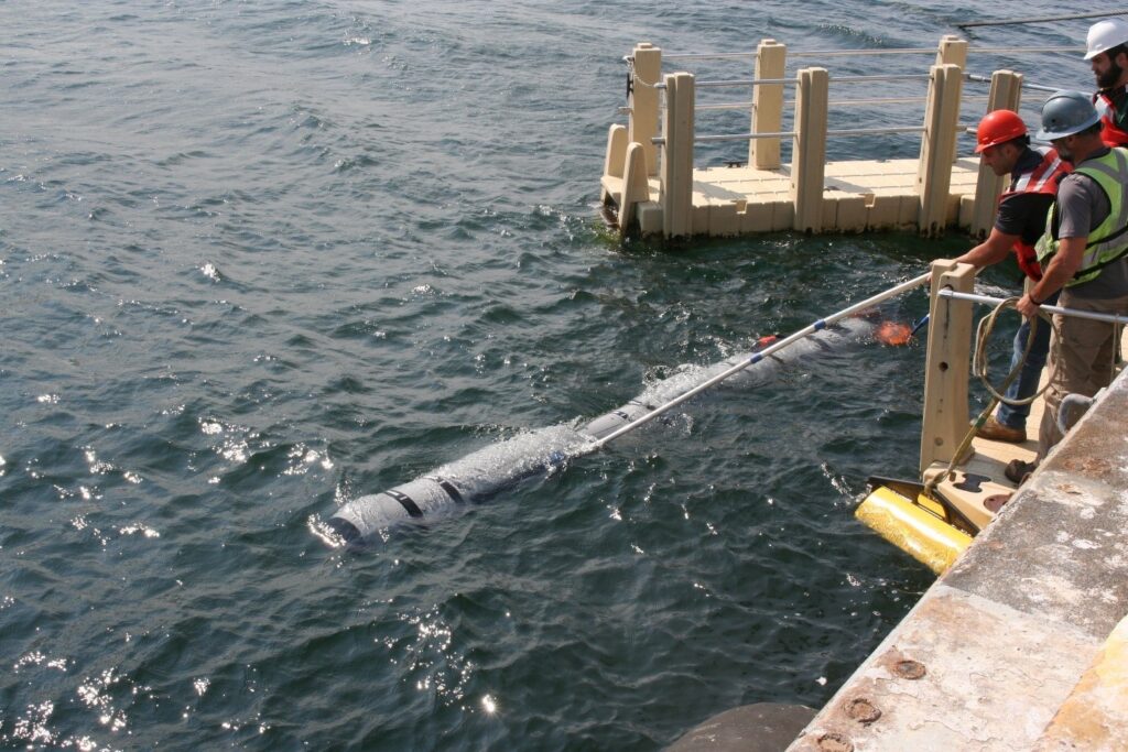 HII’s REMUS 620 launching under the watchful eye of Adrian Gonsalves, the REMUS 620 Product Lead as it departs for torpedo tube recovery testing in Seneca Lake (Photo: HII via U.S. Navy’s Naval Undersea Warfare Center Division Newport)