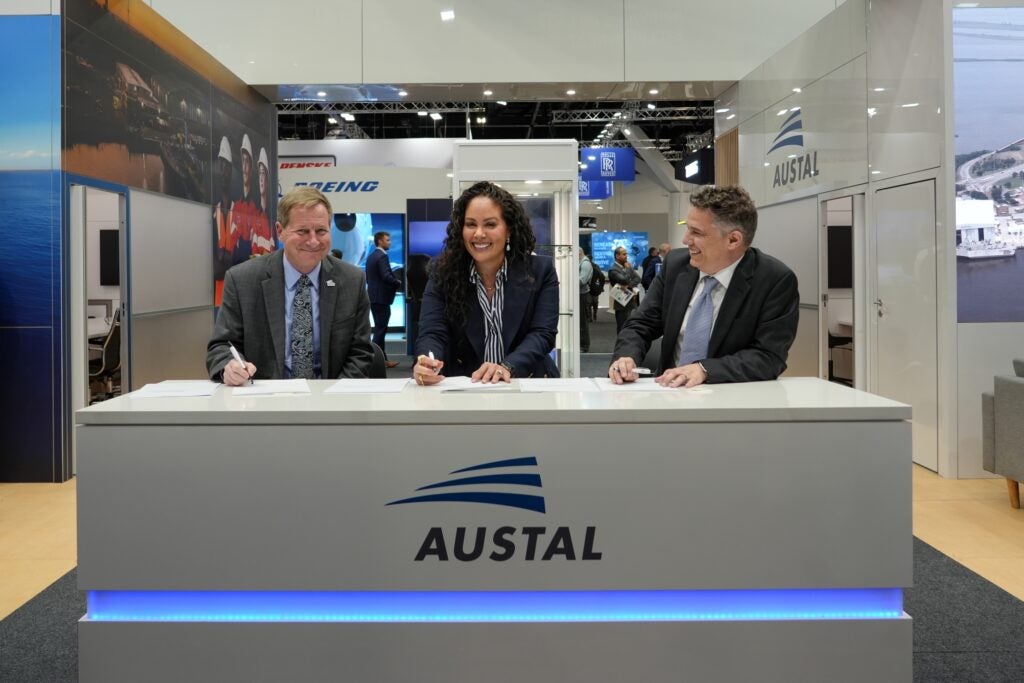 Officials from Austal USA and Australia’s ASC sign a Memorandum of Understanding (MoU) to collaborate on additive manufacturing (AM) technologies and workforce development for submarine maintenance and production during a November 2025 expo. Left to right: Austal USA Vice President Business Development & External Affairs Lawrence Ryder; ASC Chief Capability Officer Danielle Bull and Austal Australia Chief Technology Officer Dr. Glenn Callow. (Photo: Austal)