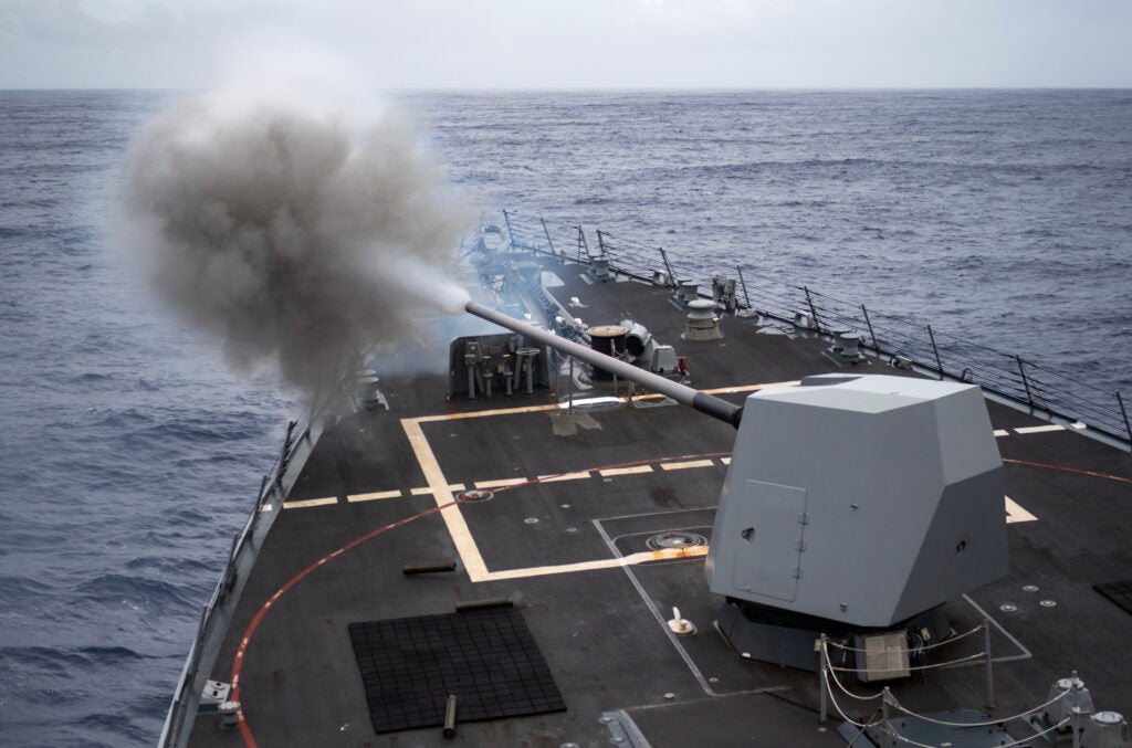 Arleigh Burke-class guided-missile destroyer USS Halsey (DDG-97) fires its five-inch gun while underway for basic phase certification and training in Dec. 2019. (Photo: U.S. Navy by Mass Communication Specialist 1st Class Devin M. Langer)