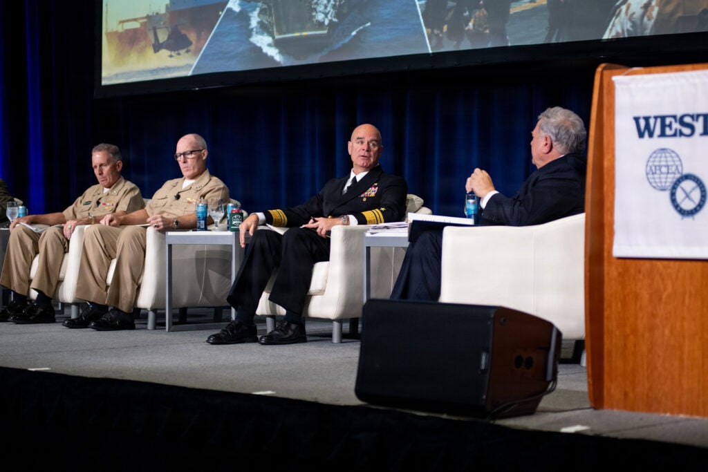 Vice Adm. Brendan McLane, commander, Naval Surface Force, U.S. Pacific Fleet (CNSP), center, speaks on a Feb. 10 panel at the WEST 2026 conference in San Diego. (Photo: U.S. Navy by Mass Communication Specialist 1st Class Claire M. Alfaro)