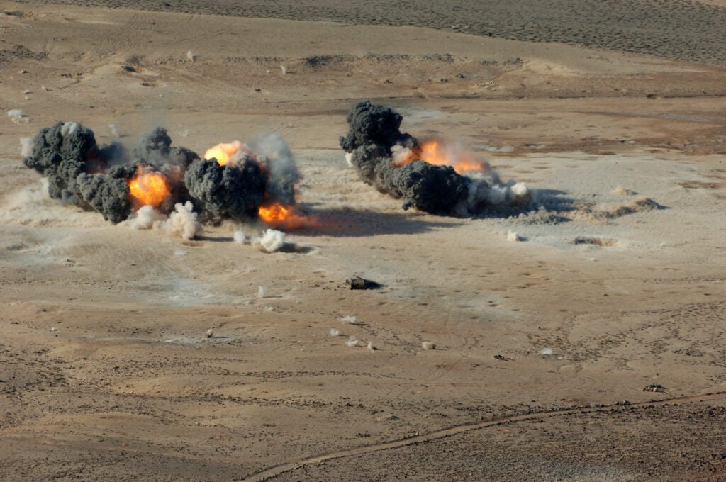1,000-pound BLU-110 MK-83 and 500-pound BLU-111 MK-82 hard target penetrating bombs explode at the Gordia range off the coast of Djibout in 2007 upon delivery from navy F/A-18 Hornet aircraft. (Photo: U.S. Navy)