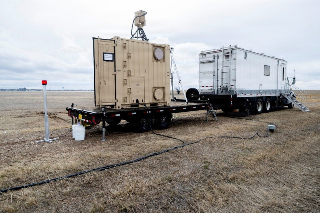 Boeing's laser system intended for dual-use in power beaming and aerial defense sits in the field for testing. The U.S. Naval Research Laboratory works with Boeing and the U.S. Army in testing the capability of a dual-use laser systems. (Photo: U.S. Navy by Jonathan Steffen-Arnold)