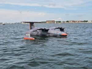 A one-quarter scale REGENT Squire unmanned drone seaglider operates in Narragansett Bay in Newport, R.I. during the BlueTide 2026 showcase and demonstration event. (Photo: Richard Abott for Defense Daily)