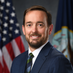 Christopher Miller, head of PAE Maritime, was announced in August 2026 to also serve as the acting Direct Reporting Portfolio Manager for Robotic and Autonomous Systems (RAS) and concurrently as Portfolio Acquisition Executive (PAE) for RAS. (Photo: U.S. Navy)