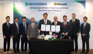Representatives from HD Hyundai and Kiewit sign an agreement to establish a joint venture to develop a new shipyard in the United States. Fifth from left is Choi Han-nae, head of corporate planning at HD Korea Shipbuilding & Offshore Engineering, and sixth is Chad Johnson, CEO of Kiewit Maritime. (Photo: HD Hyundai)
